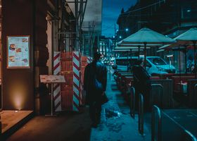People walking through the city at blue hour