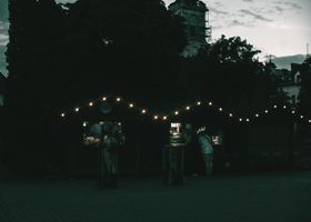 Twilight night market under string lights